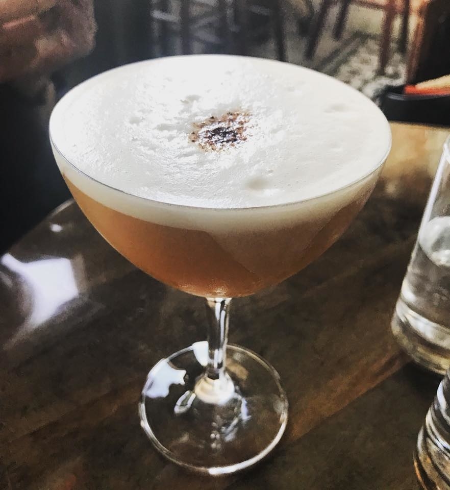 A beautiful concoction of rye, mesquite honey, ginger syrup, pineapple, lemon, and egg white, the White Rose is the perfect summer drink with a kick of spiciness from the ginger. The egg white adds smooth, fluffiness to the drink.