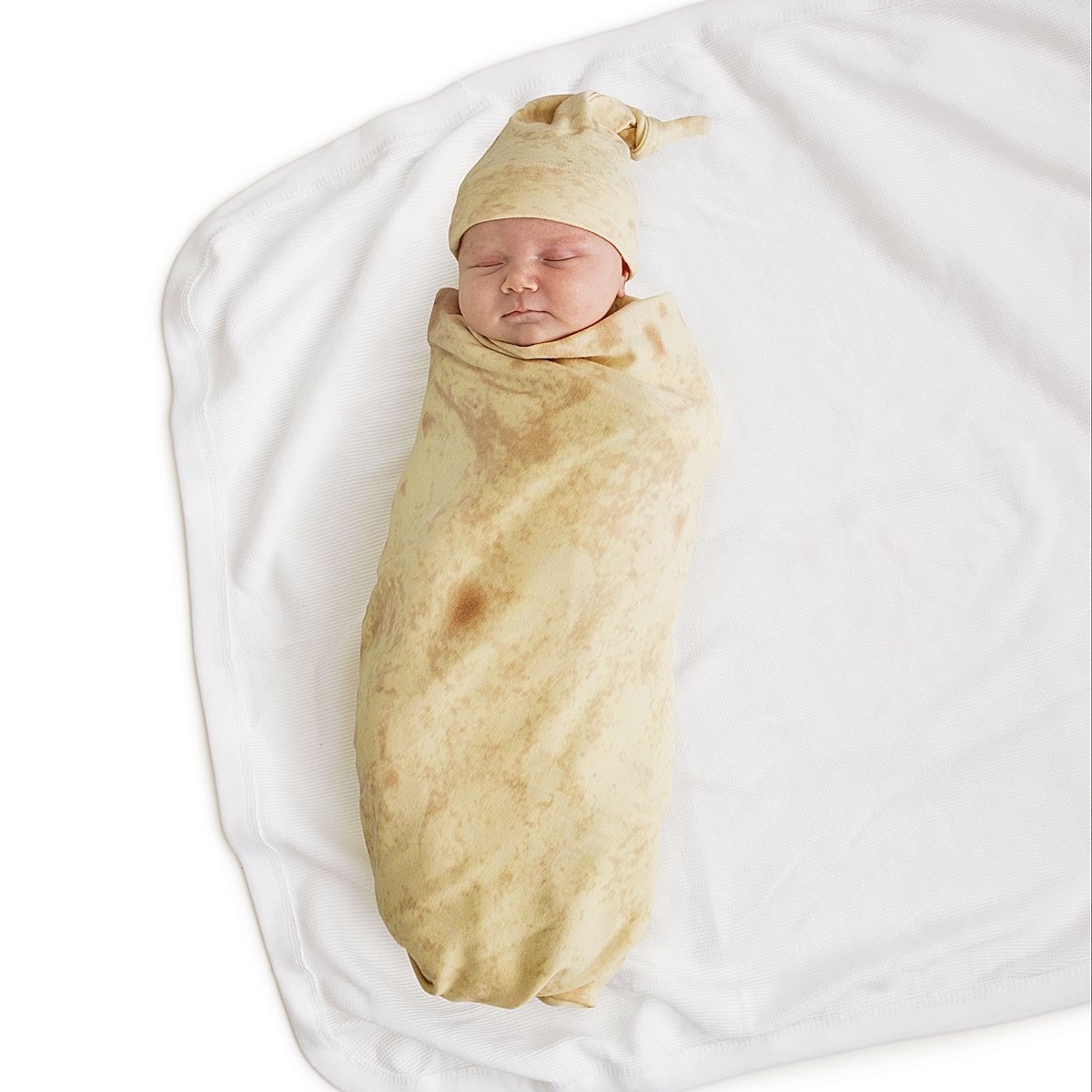 baby sleeping in the tortilla swaddle