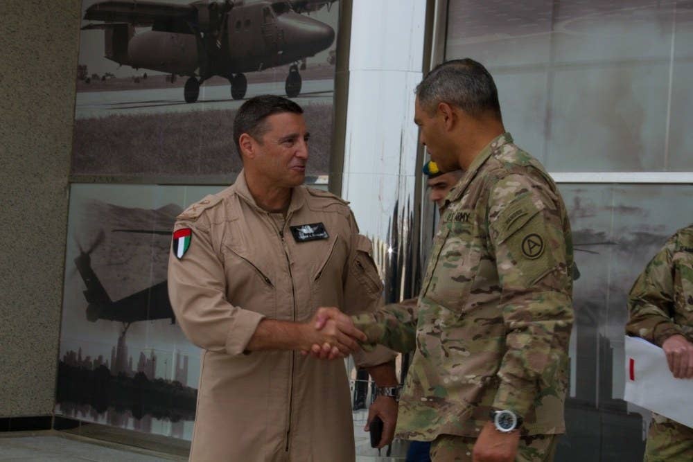 Stephen Toumajan (L) shakes hands with US Lt. Gen. Michael X. Garrett in the UAE in 2016.