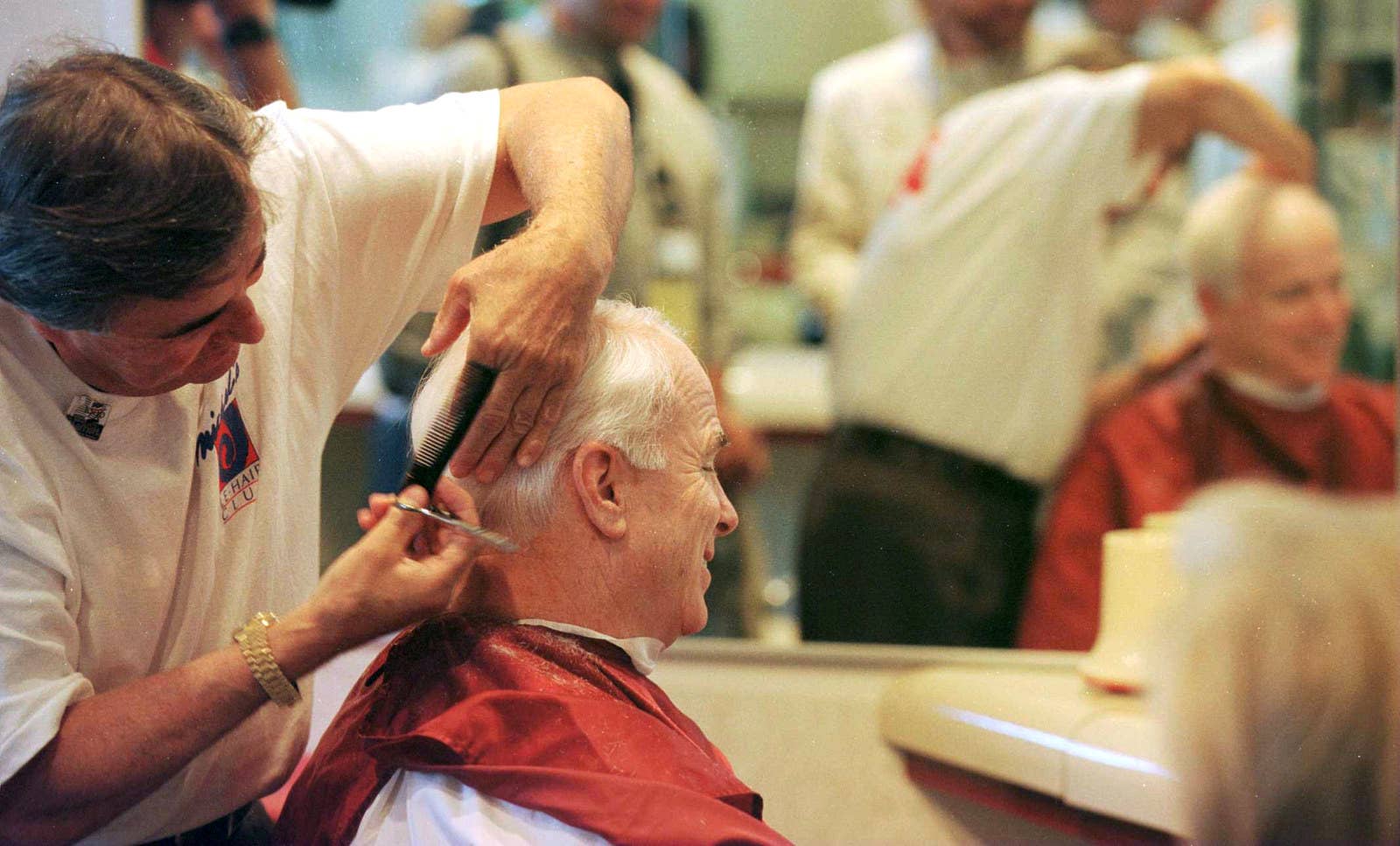 McCain gets a haircut in his hotel before the Republican National Convention begins in San Diego on Aug. 12, 1996.