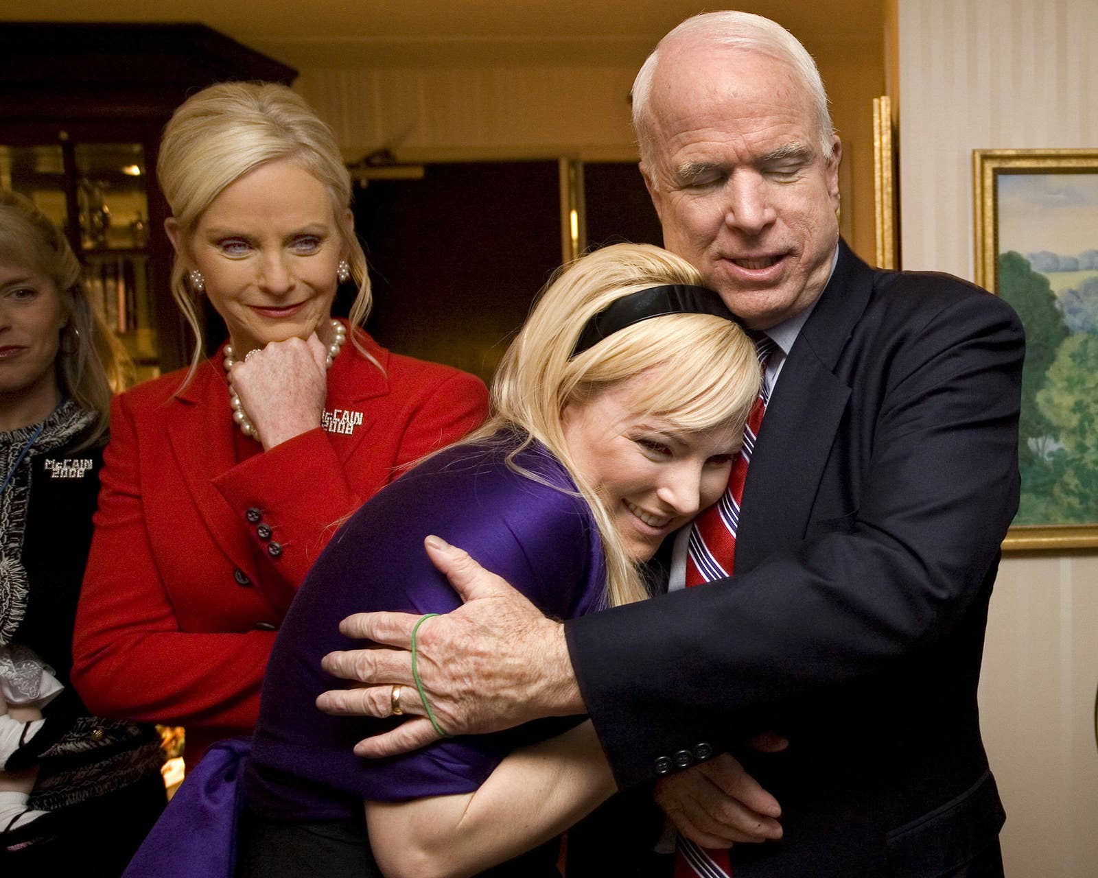 In his suite at the Crowne Plaza Hotel, Republican presidential contender McCain hugs his daughter Meghan, with his wife, Cindy, behind them, after hearing that he&#x27;s the projected winner of the Republican New Hampshire primary on Jan. 8, 2008, in Nashua, New Hampshire.