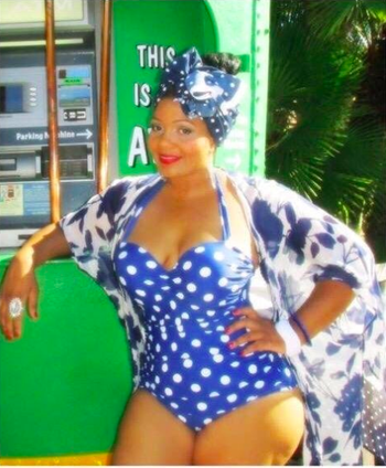 reviewer photo wearing blue polka-dotted swimsuit