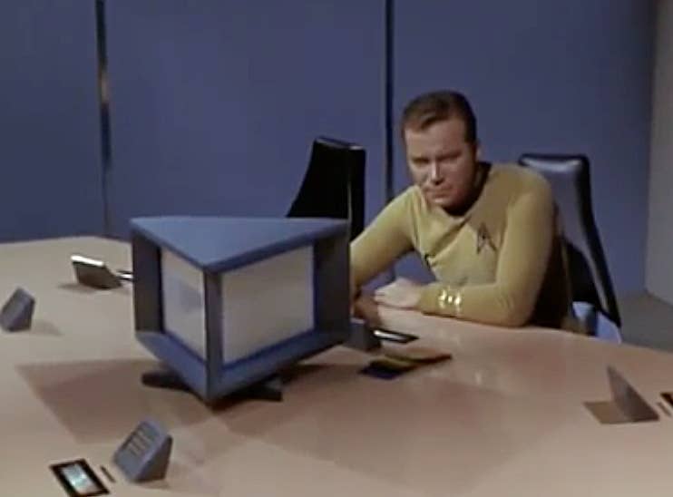 Captain James Kirk (William Shatner) on Star Trek: The Original Series using the Library Computer Access and Retrieval System voiced by Majel Barrett-Roddenberry.