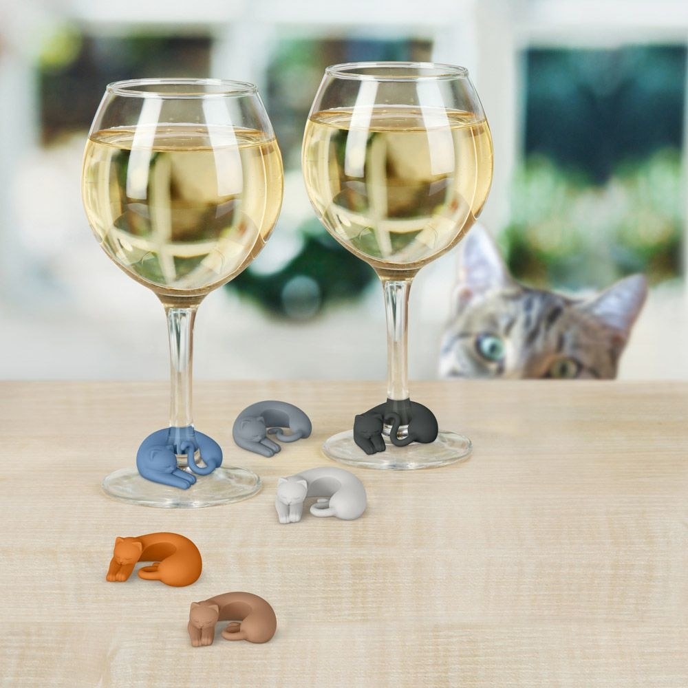 small plastic kittens that curl around the stems of wine glasses