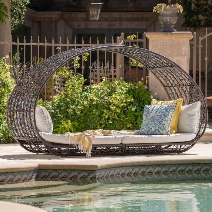 the grande outdoor daybed by a pool