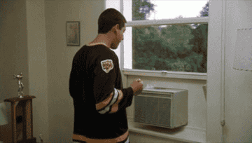 Gif of Happy Gilmore accidentally dropping an AC out the window 