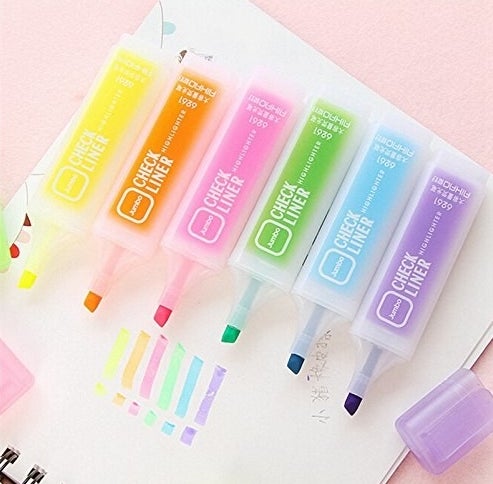 red, orange, pink, green, blue, and purple highlighters that are more pastel than bright 