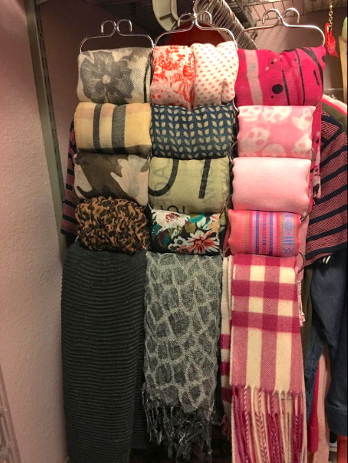A customer review photo of the hanger filled with scarves