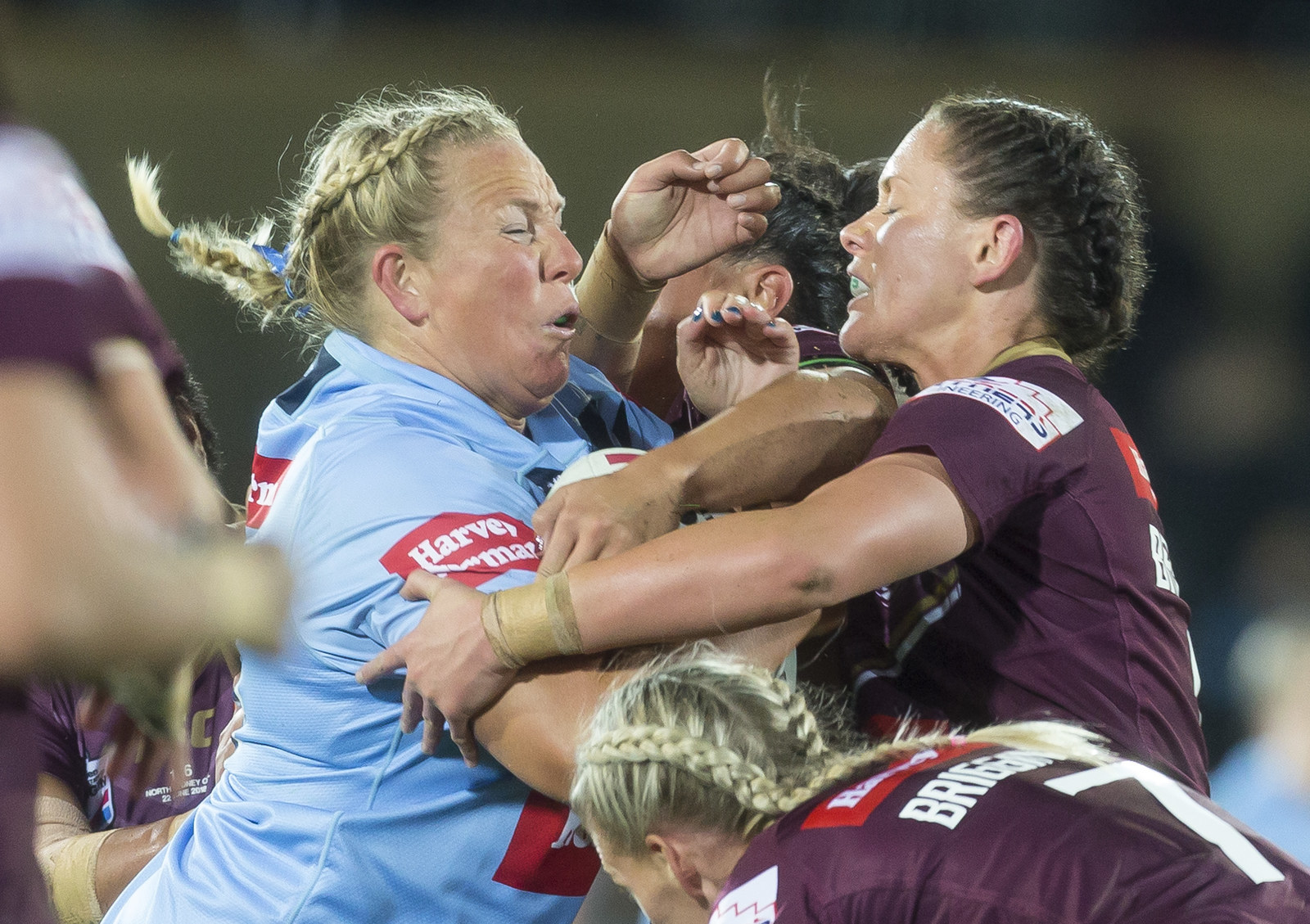 State of Origin women flaunt figures in bikinis during the NRL game