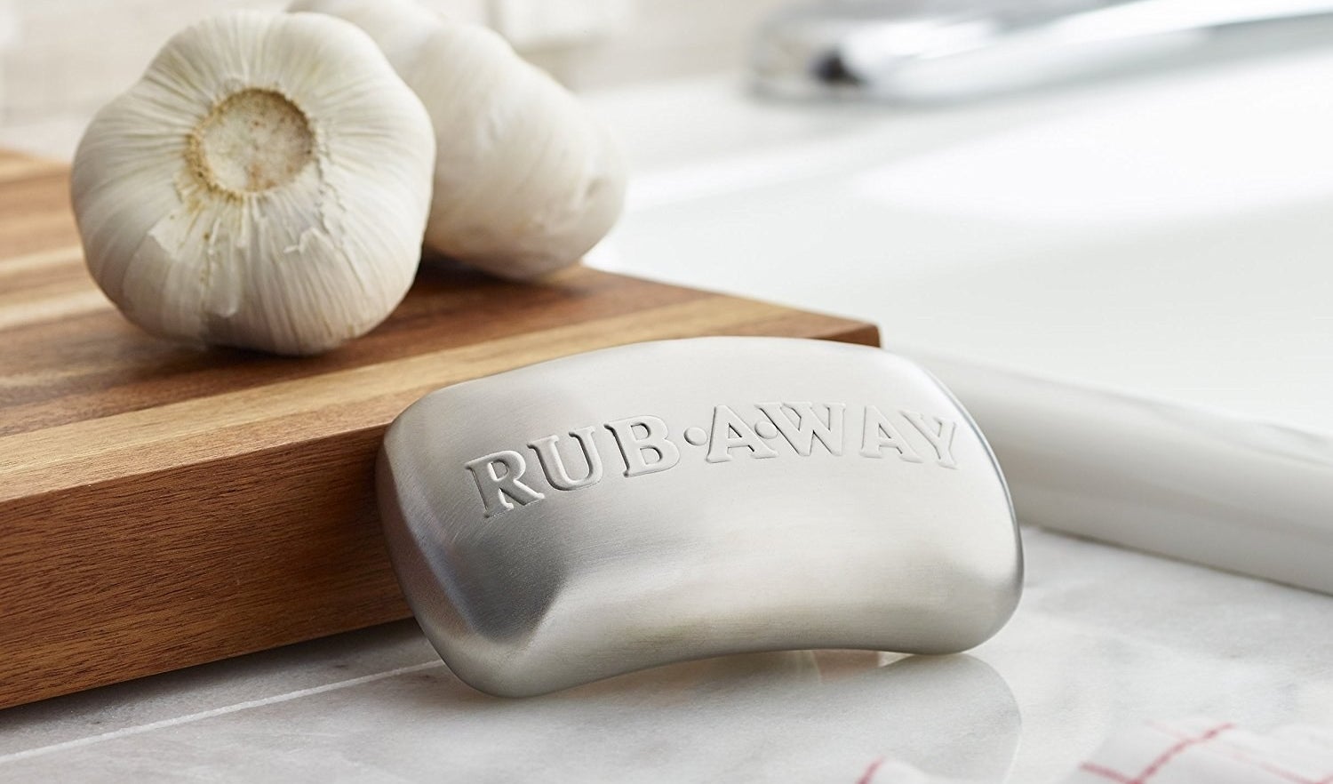 The soap bar-shaped stainless steel, with the text &quot;rub away&quot; on it