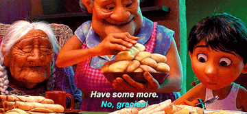 The grandmother from &quot;Coco&quot; serving some tamales to her grandson