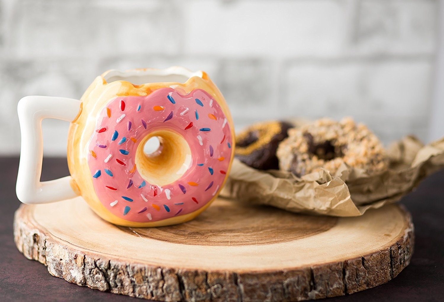 mug shaped like pink doughnut with bite taken out of top