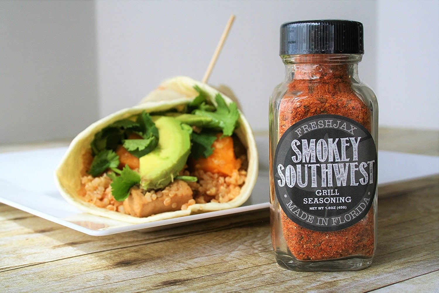 a bottle of smokey southwest seasoning next to a taco