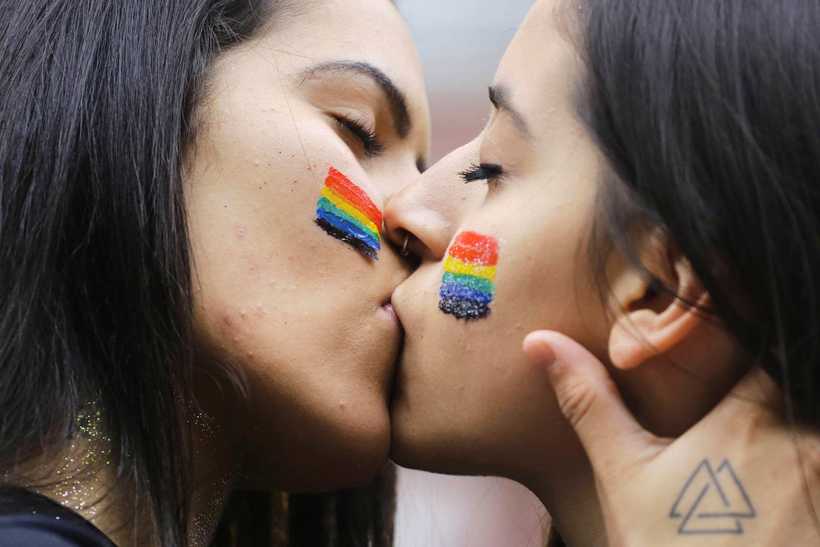 Revelers kiss during the annual gay pride parade in Sao Paulo, Brazil, on J...
