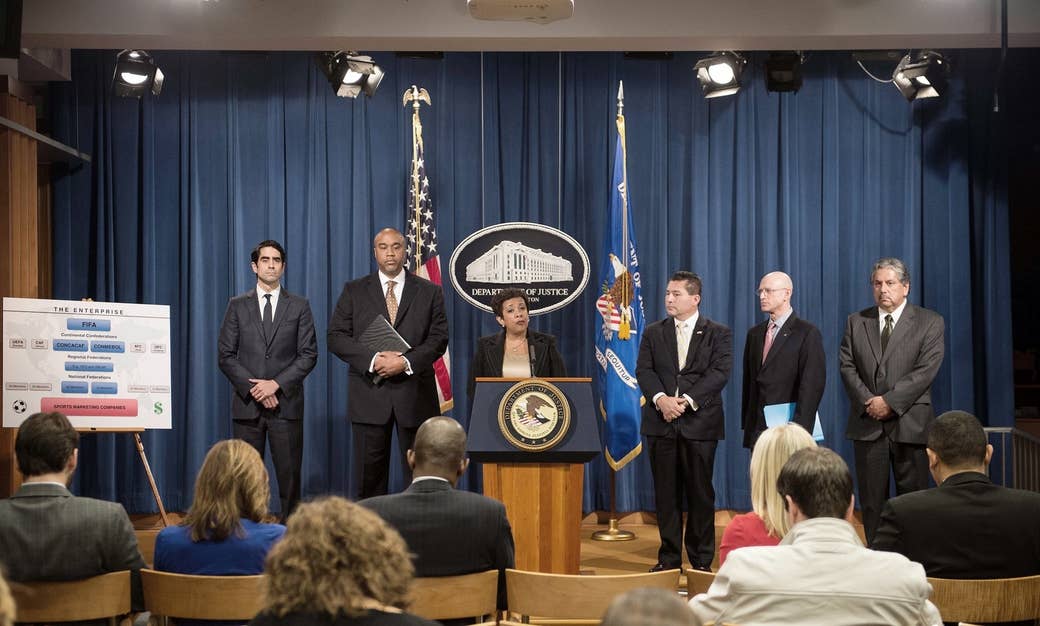 US Attorney General Loretta Lynch speaks at a press conference with (from left) Evan Norris, Robert Capers, FBI Assistant Director Diego Rodriguez, IRS Criminal Investigation Chief Richard Weber, and IRS Special Agent Erick Martinez about the corruption scandal engulfing FIFA at the Justice Department in Washington, DC, on Dec. 3, 2015.