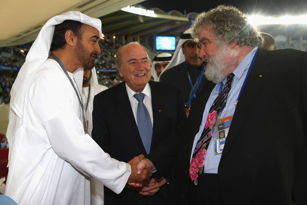 FIFA President Sepp Blatter (center) looks on as the crown prince of the United Arab Emirates, Sheikh Mohammad bin Zayed Al Nahyan, and Chuck Blazer shake hands after the FIFA Club World Cup fifth-place match on Dec. 16, 2009.