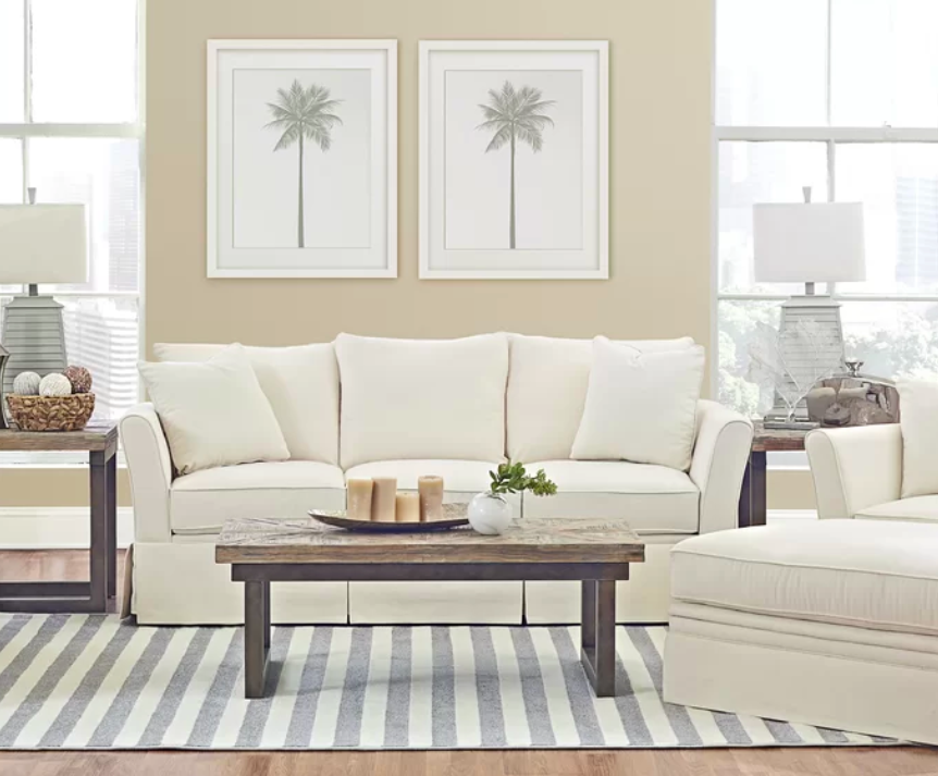 Length: 69"Promising review: "I wanted a white sofa and loveseat in a transitional style that would add a "wow" factor but still be comfortable. I have both. Very pleased. It is a firmer type of seating, but we prefer that, and it generally looks better longer. Delivery was several weeks sooner than anticipated, and the pieces arrived very well protected. We are delighted!" —NancyGet it from Birch Lane for $950 (available in three colors and a matching loveseat).