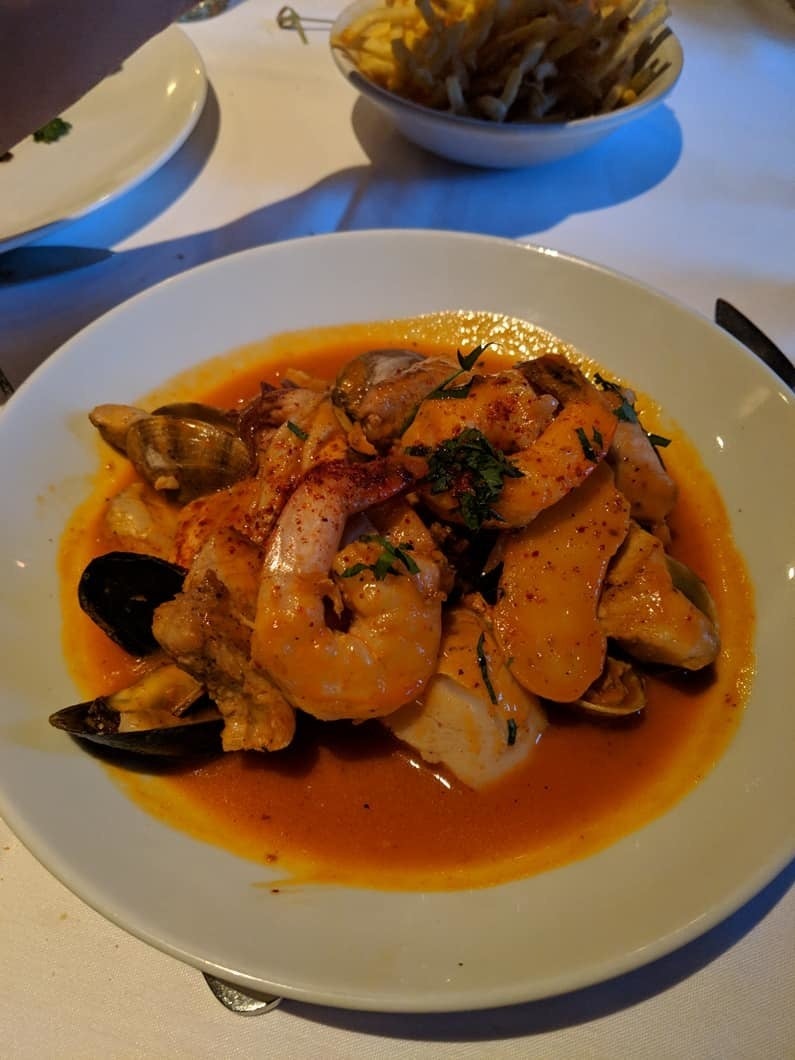 One of the fan favorites is the seafood stew made of plump, juicy shrimp, mussels, clams, calamari, scallop, and fish all braised in hearty tomato-pepper sauce. You'll want extra bread to dip into this delicious broth.