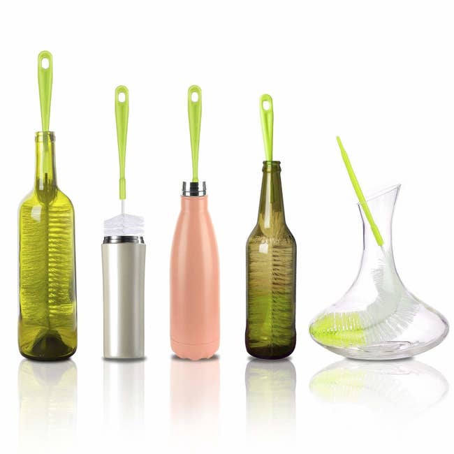 various sized bottles with brushes in them