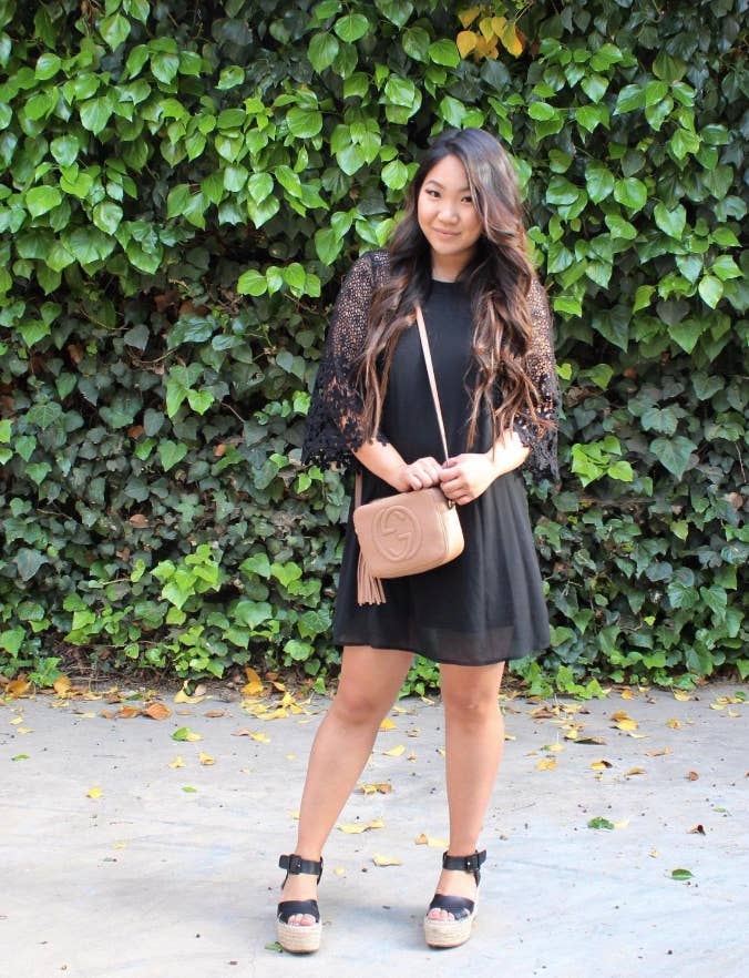 reviewer wears midi dress with lacy wide quarter sleeves
