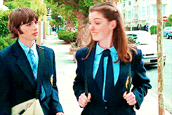 In the books: Mia and Michael spend the first few books as witty sparring partners, close friends, and unrequited crushes. Mia sends Michael secret love notes, Michael writes a thinly veiled love song about her, which it all leads up to the kiss of all kisses at the Non-Denominational Winter Dance. In the movies: Sure, we got some flirty yet awkward conversations, M&Ms on pizza and a foot-poppin' kiss, BUT WHAT ABOUT THEIR BEAUTIFUL LOVE STORY???