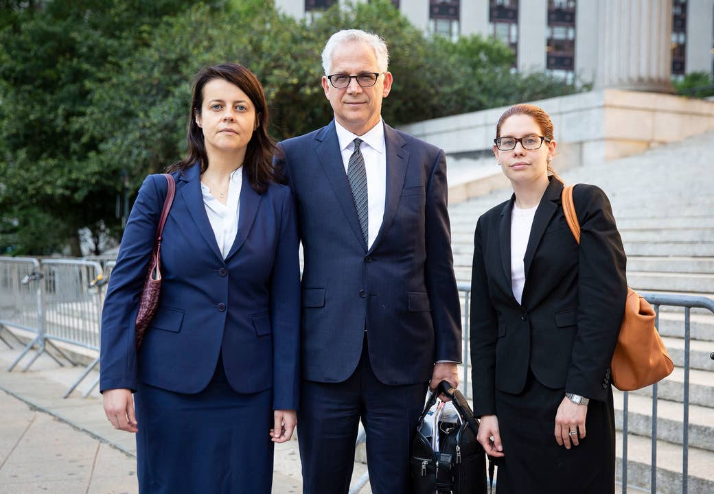 Ravina, left, with her lawyers.