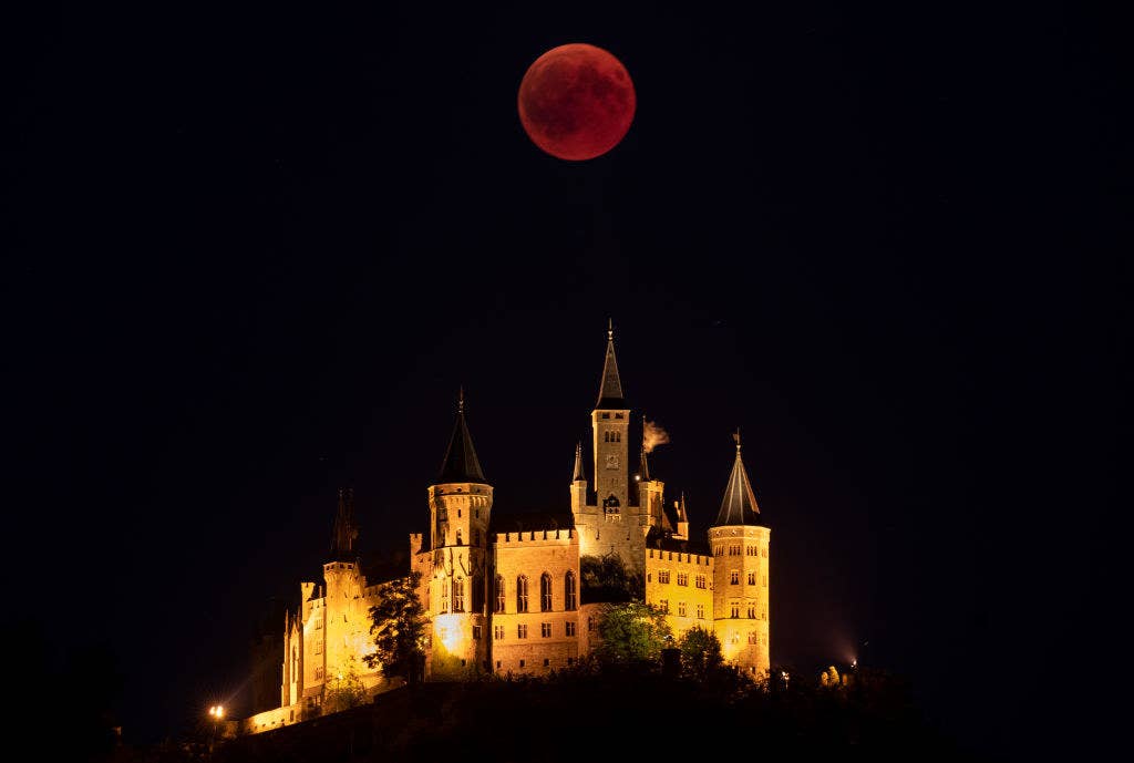 A blood moon rises behind Hohenzollern Castle in Hechingen, Germany.