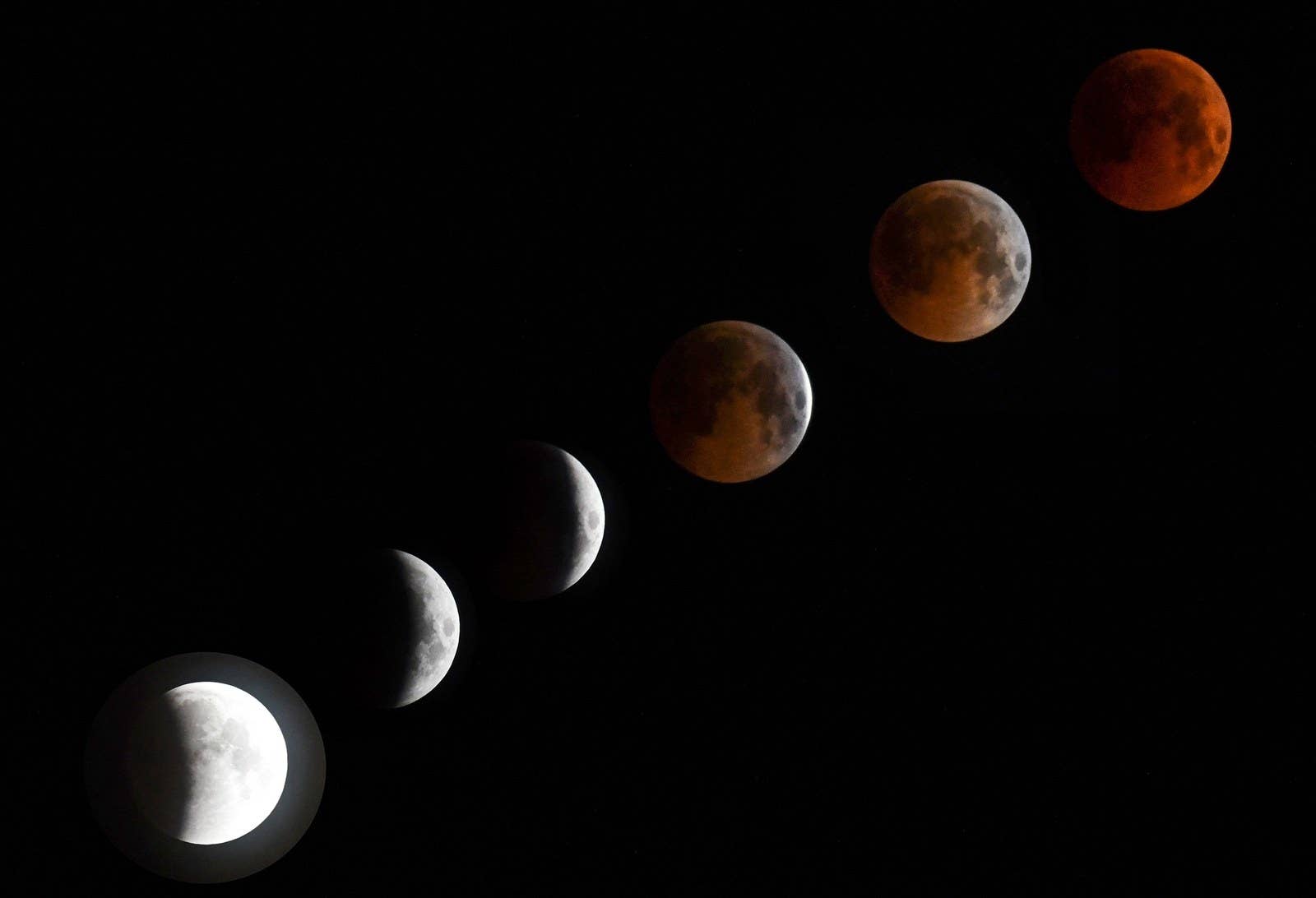 A combo of six pictures shows a the eclipse in various states in Bishkek, Kyrgyzstan.