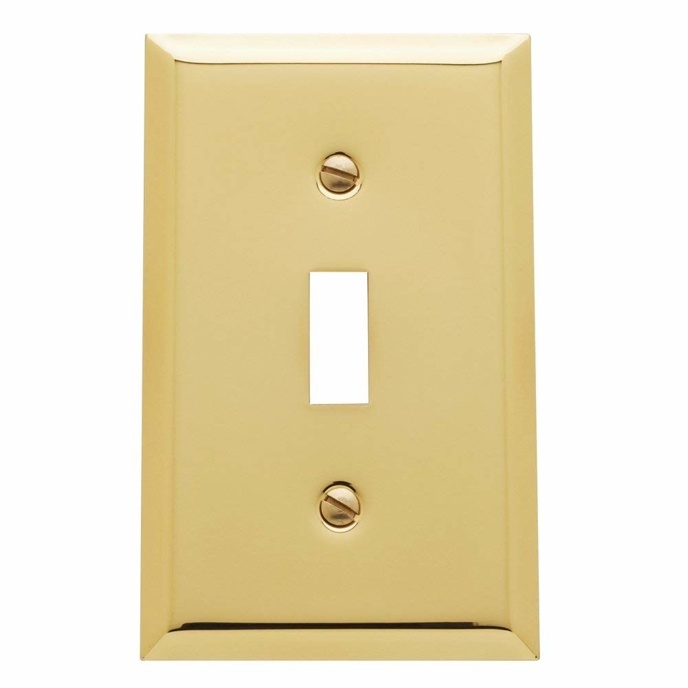 A brass light switch