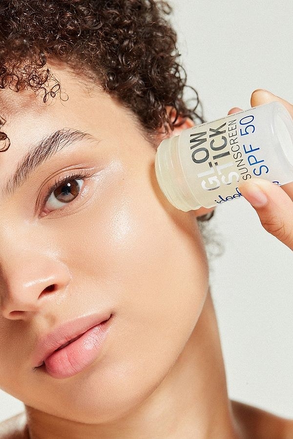 Promising review: "The only holy grail *ever* for me was Chanel’s Instant Lash Mascara, until today. I love this sunscreen. It’s so easy to put on my cat could do it. I had no problem pushing up the tube and gliding away on my face. There is no scent, no tackiness — just a super light balm that covers your face in seconds. It leaves a light sheen, but it looks healthy and it works well under my liquid foundation and on my combination skin. It’s so handy to travel with, too — just toss it in your bag. I’m really impressed." —bmasGet it from Sephora for $25 or Urban Outfitters for $25.