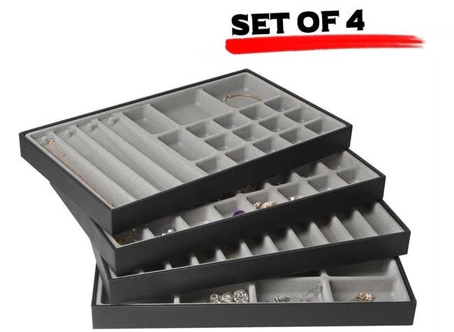 The set of four, with small and large square and long rectangular slots for different jewelry