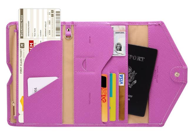 The purple wallet open to show how much it holds