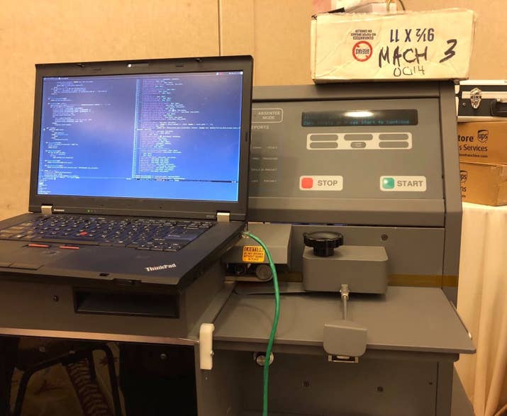 A hacker’s laptop hooked up to an ES&amp;S M650 Optical Scan Tabulator.