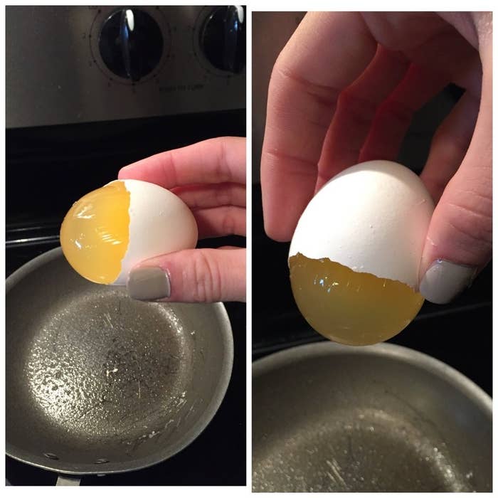 An egg that is missing half the shell, but has a clear yolk that hasn&#x27;t broken yet