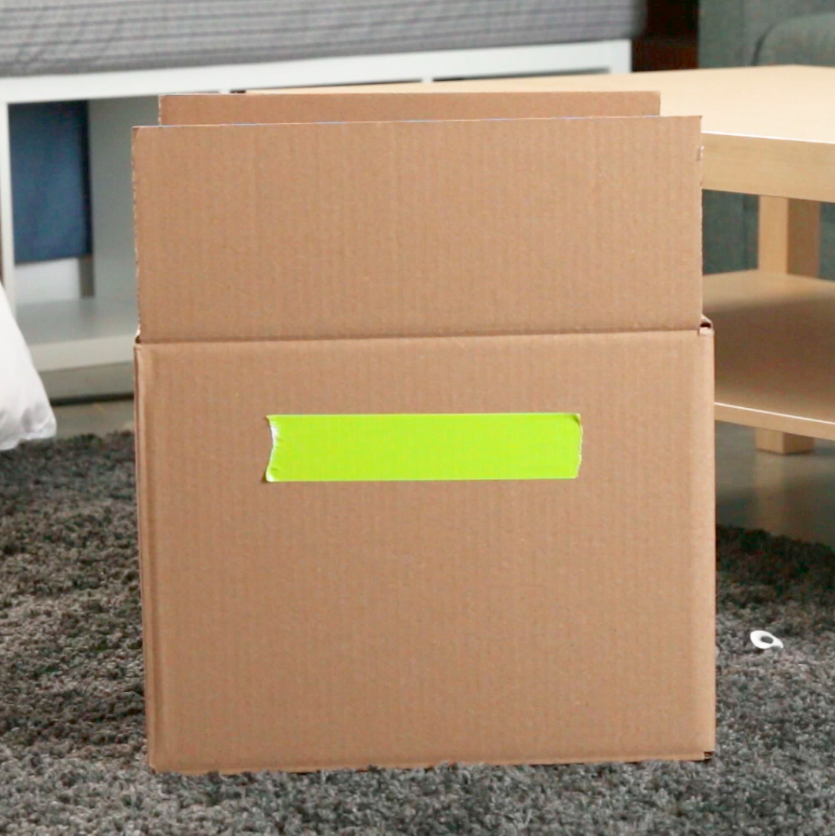 cardboard box with duct tape on the side