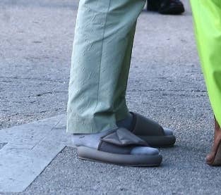 Kanye West ridiculed for wearing tiny Yeezy slides and socks to wedding -  NZ Herald