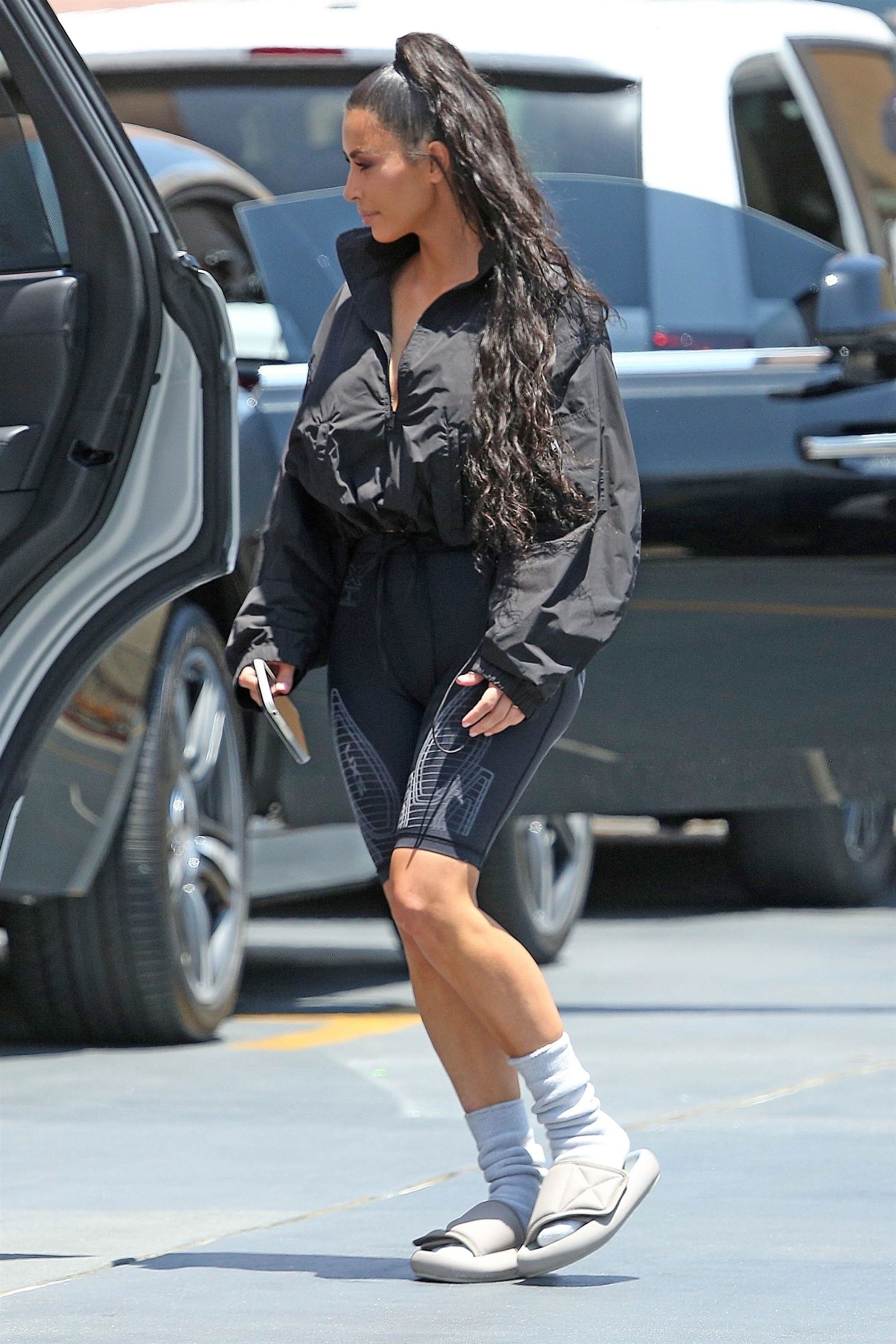 kim in yeezy slides