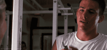 GIF of Channing Tatum swinging his neck while answering his phone
