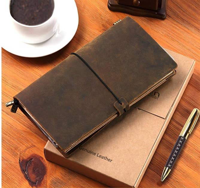 Promising review: "I really enjoyed having this on my trip. I like that I can remove the journal after I'm done filling it and store it as my New Zealand travel journal and then put in a replacement for my next adventure. I also like having room to store ticket stubs, maps, or small coins. The leather holds up nicely, and the pen writes smoothly." —Tina BGet it from Amazon for $25.47.