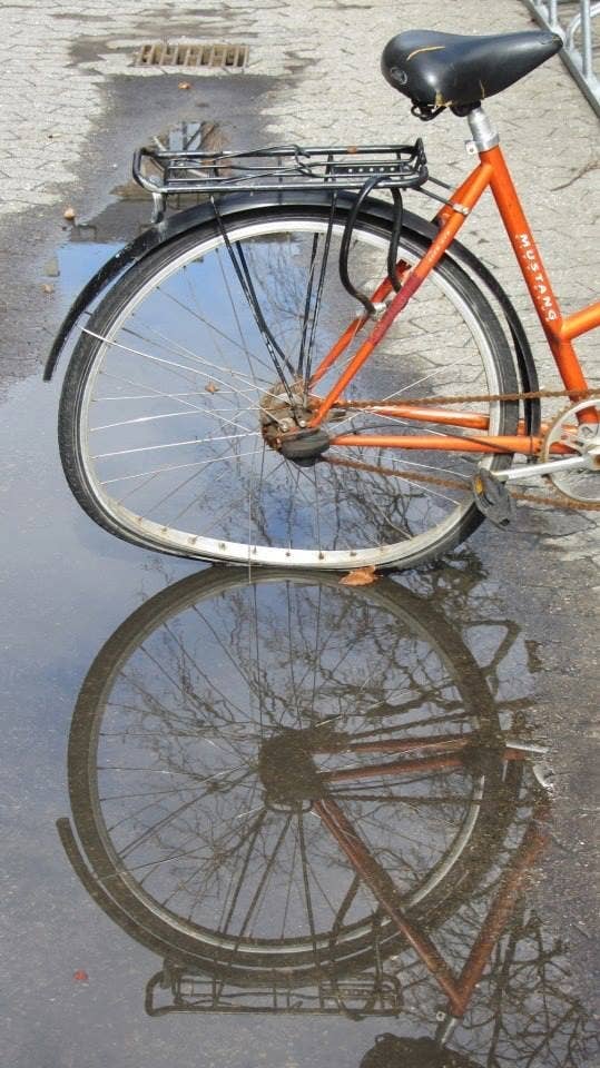 bike reflection in puddle