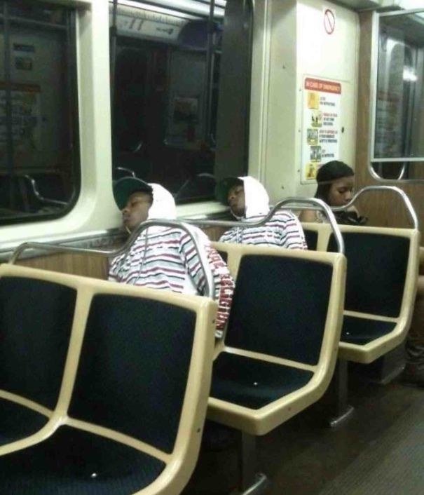 two people sleeping on the subway in the same outfit