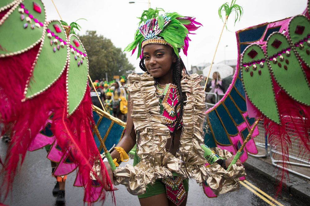 Everyone's Dancing In The Rain At Notting Hill Carnival Because Britain