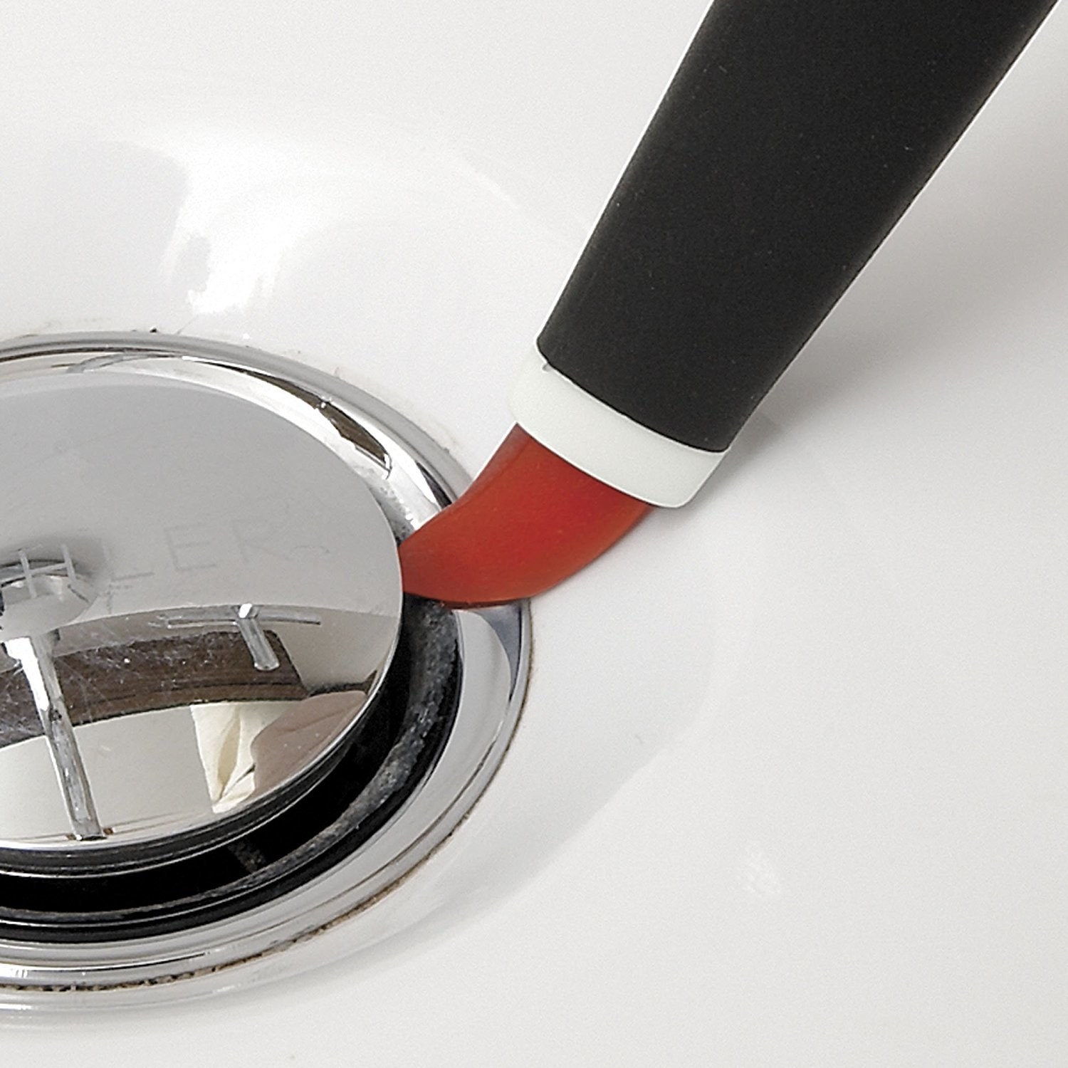 detail cleaner brush erasing grime around a sink drain