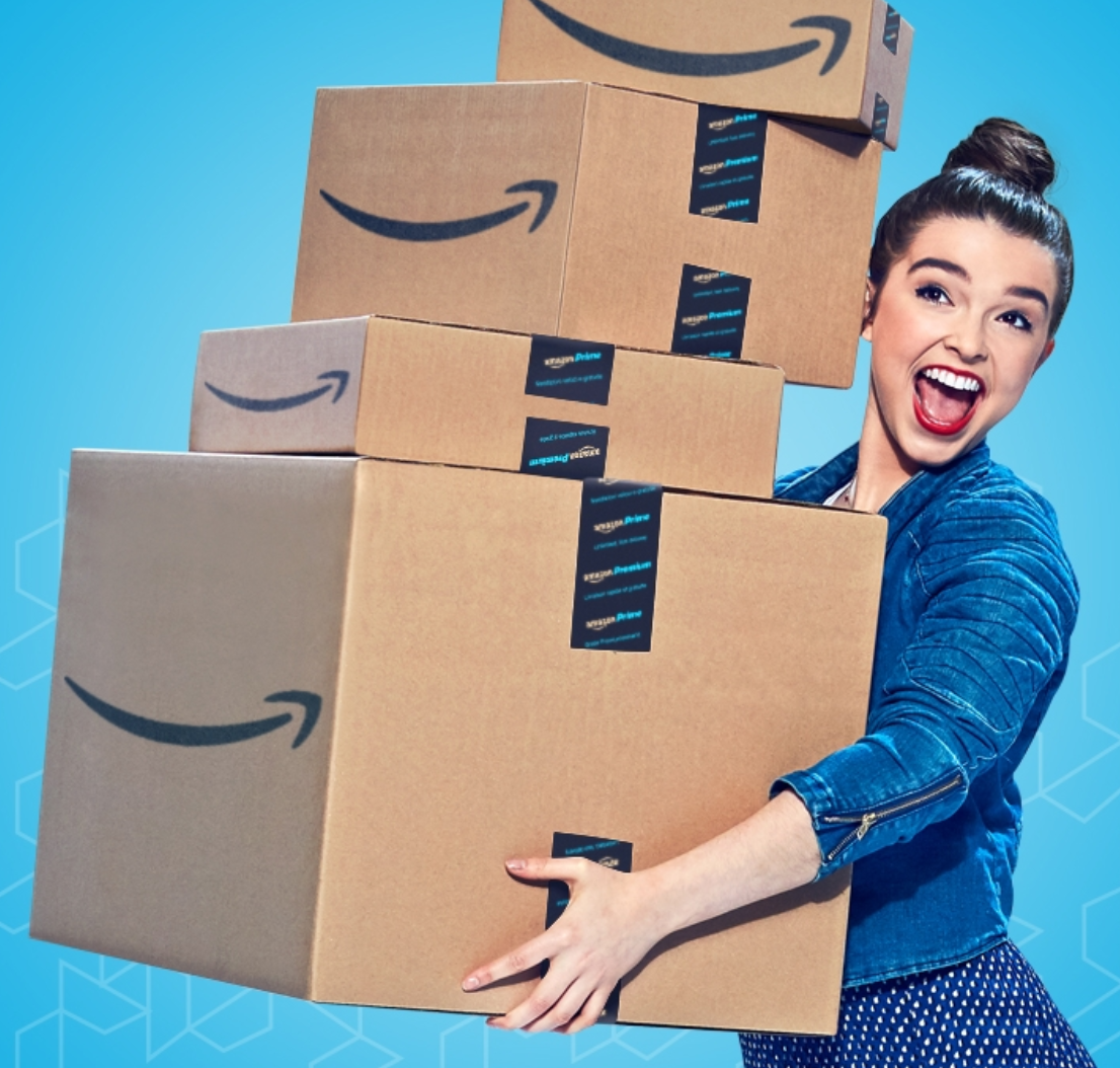 model holding Amazon boxes