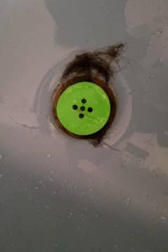 another reviewer's pic of top view of the tubshroom with hair caught around it