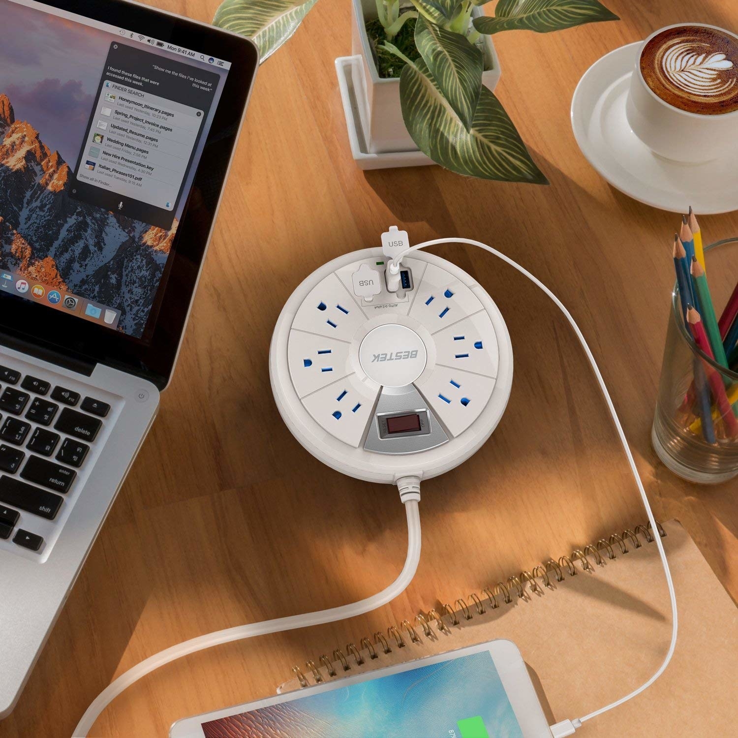 the white circular power strip, which has six outlets and two USB ports