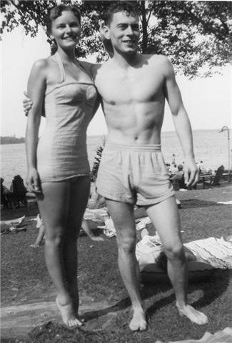 A couple in an old photograph from years ago, in bathing suits