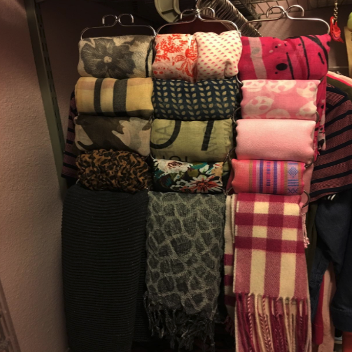 The same scarves but now neatly folded and organized on the hanger