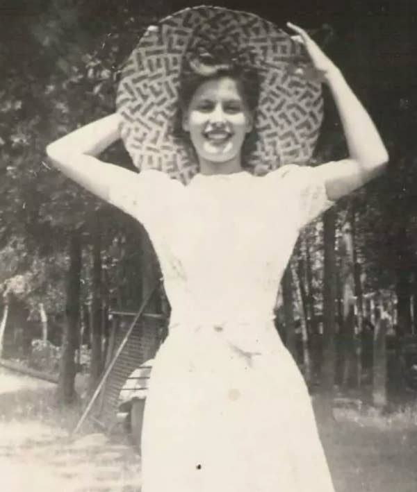 A woman wearing a large hat