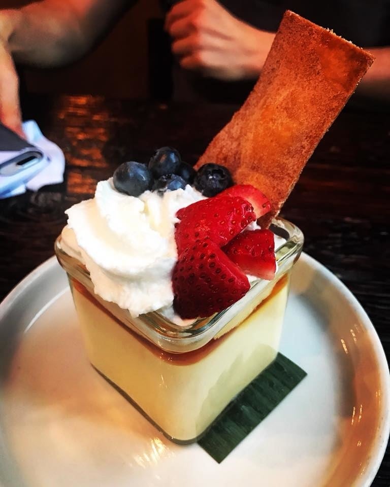 Perfect sweet ending to the meal, rich, creamy Passion Fruit Flan is topped with berries and whipped cream, along with cinnamon sugar totopo.